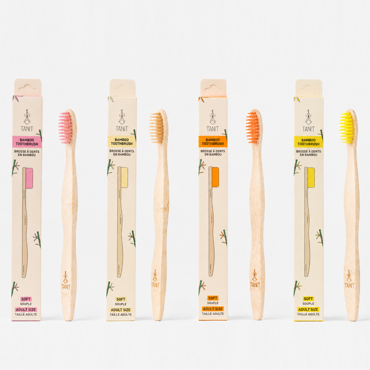 Quatre brosses à dents en bambou TANIT pour adultes avec leur emballage